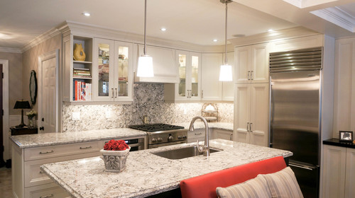 Cambria Bellingham Full High Backsplash and Countertop and Cambria Bellingham Island Top with Stainless Steel Appliance and Willow White Cabinets.